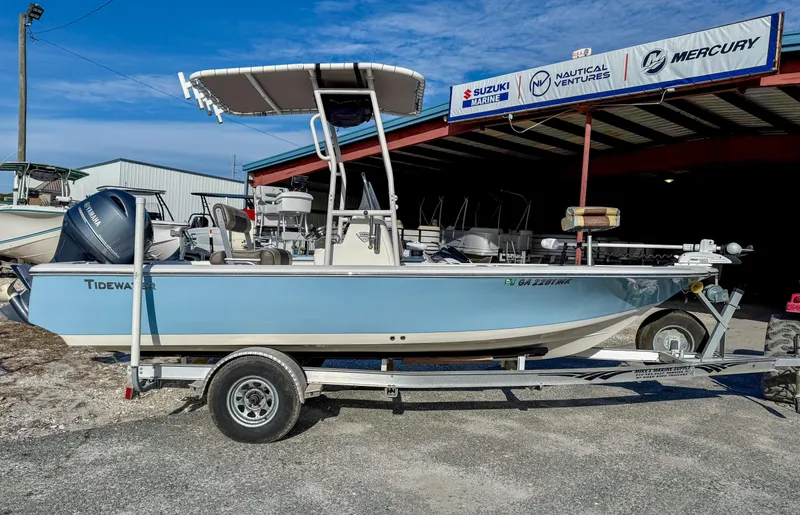 Slide: The Image of 2018 Tidewater 1910 Bay Max boat on trailer, parked outside a dealership. - 13