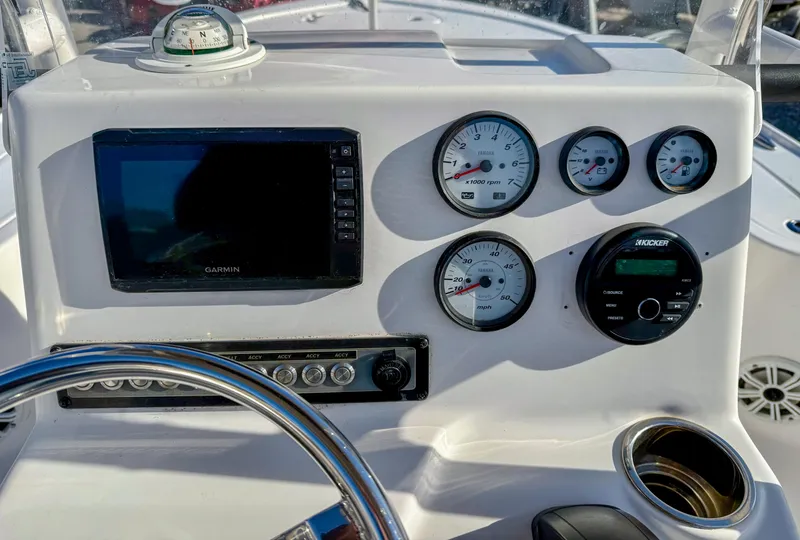 Slide: The Image of Dashboard of 2018 Tidewater 1910 Bay Max boat with gauges and Garmin display. - 15