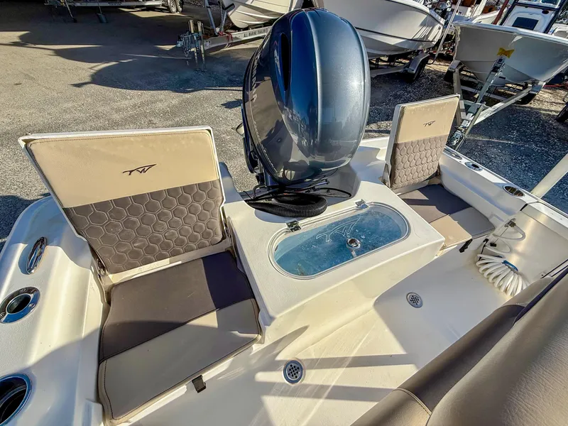 Slide: The Image of 2018 Tidewater 1910 Bay Max boat interior with seating and motor. - 5