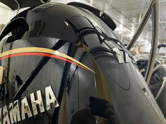 Slide: The Image of 2025 Bennington M22 Swingback with Yamaha engine, close-up view in showroom. - 9