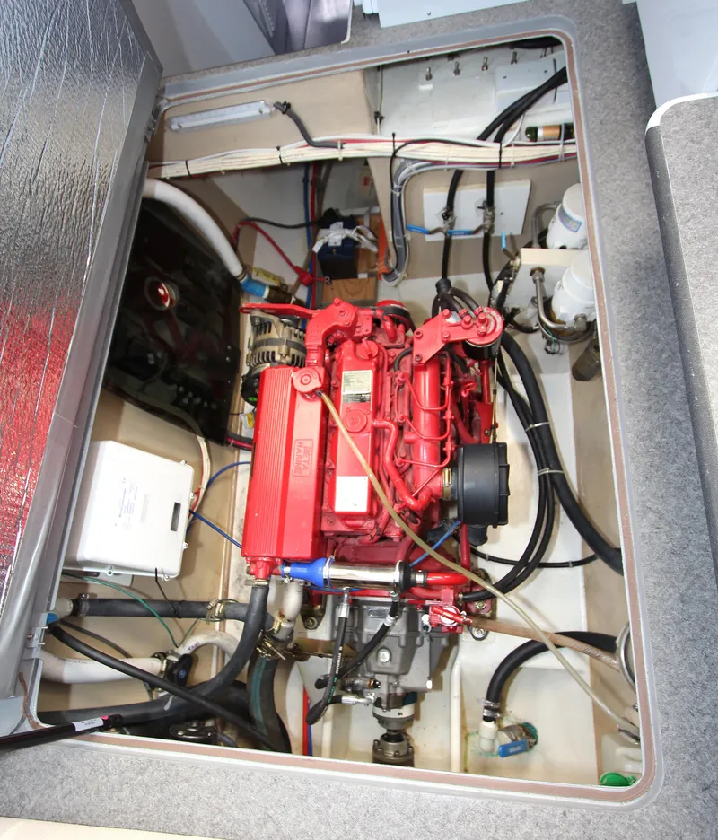 Slide: The Image of Engine compartment of 2018 Chris White Atlantic 49 MastFoil sailboat, featuring a red engine. - 12