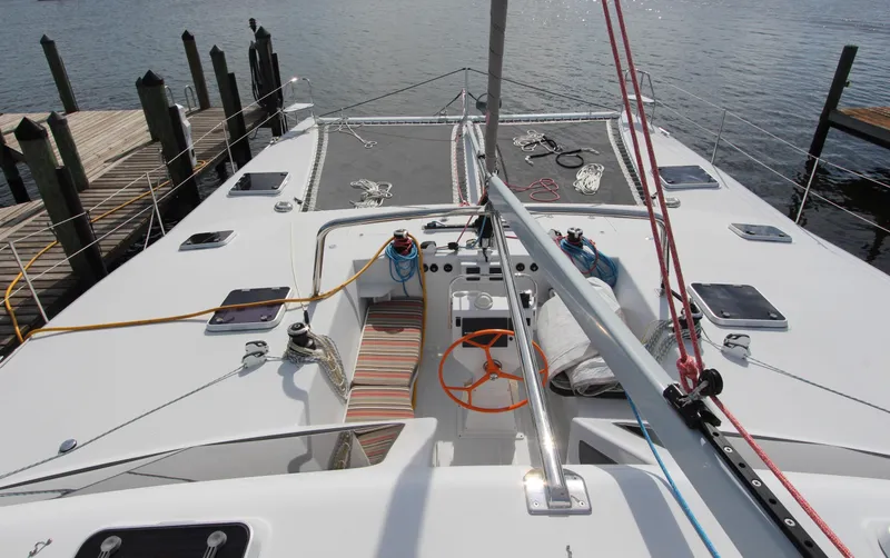 Slide: The Image of 2018 Chris White Atlantic 49 MastFoil yacht docked, showcasing deck and rigging. - 4