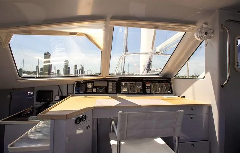 Slide: The Image of Interior view of 2018 Chris White Atlantic 49 MastFoil yacht cockpit with city skyline. - 8