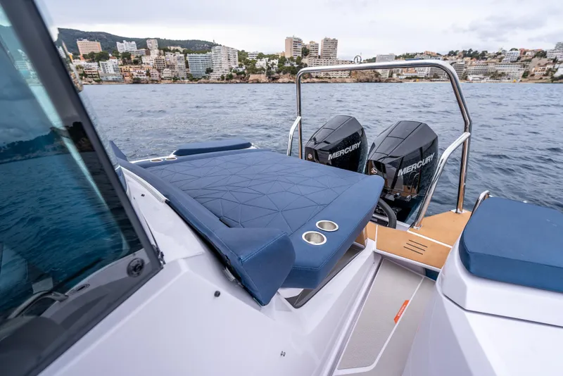 Slide: The Image of 2025 Axopar 29 XC Cross Cabin boat with dual Mercury engines on the water. - 16