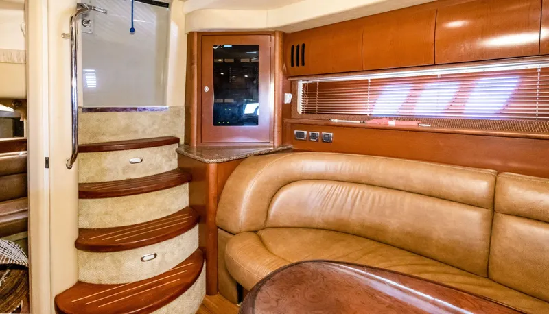 Slide: The Image of Interior of 2007 Sea Ray 44 Sundancer yacht with leather seating and wooden stairs. - 13