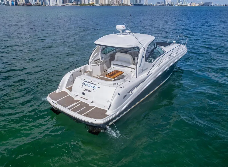 Slide: The Image of 2007 Sea Ray 44 Sundancer yacht cruising on open water. - 6