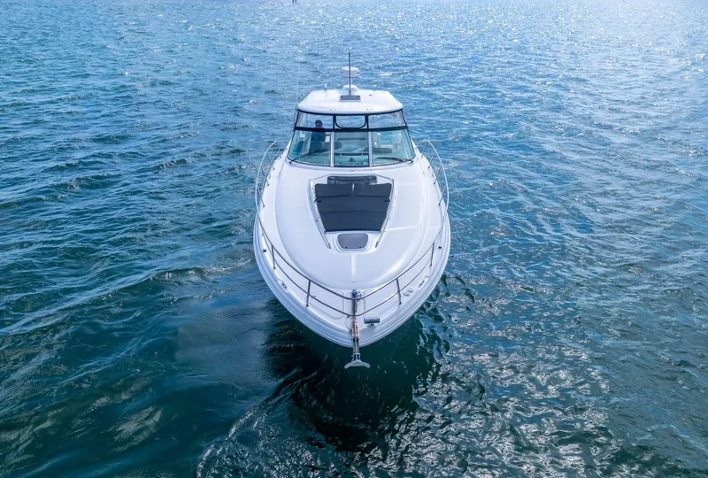 Slide: The Image of 2007 Sea Ray 44 Sundancer yacht cruising on open water. - 8