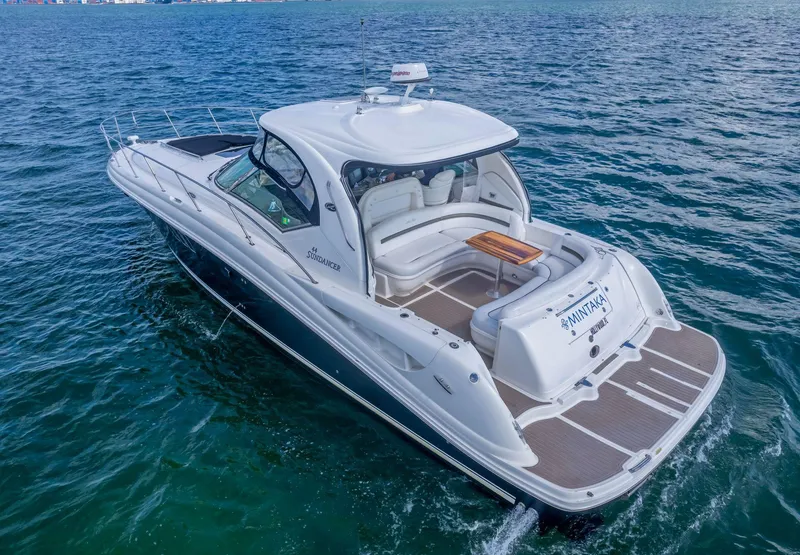Slide: The Image of 2007 Sea Ray 44 Sundancer yacht cruising on open water. - 9