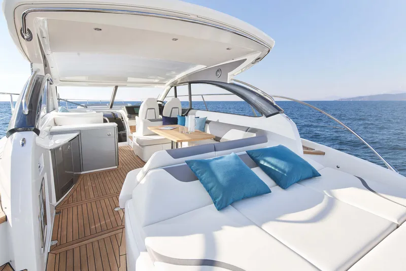 Slide: The Image of Luxurious 2026 Princess V50 Deck yacht with spacious seating and ocean view. - 4