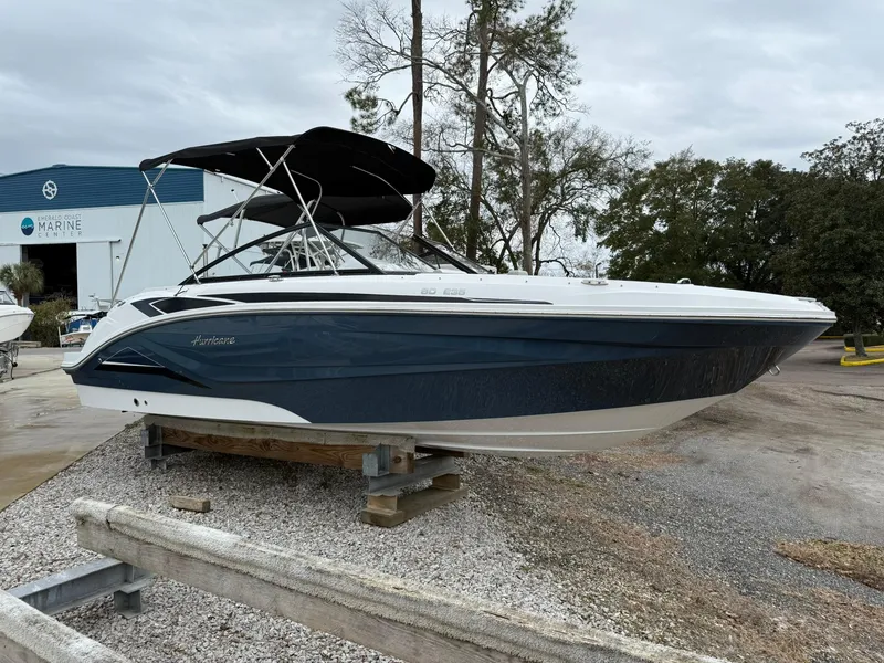 The Image of 2025 Hurricane SunDeck 235 OB boat displayed outdoors on a sunny day. - 0