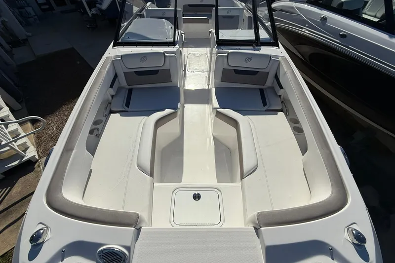 Slide: The Image of 2025 Hurricane SunDeck 235 OB boat interior with spacious seating and modern design. - 7
