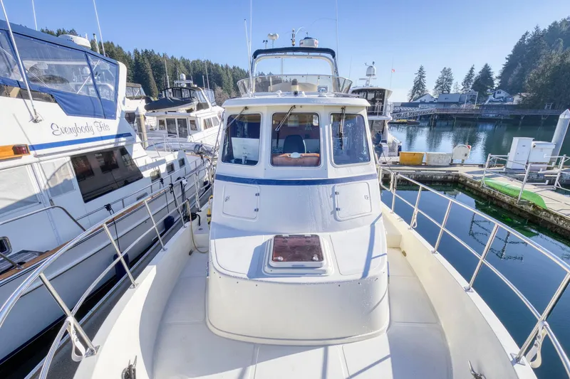 Slide: The Image of 2005 North Pacific NP42 Pilothouse docked in a scenic marina. - 39
