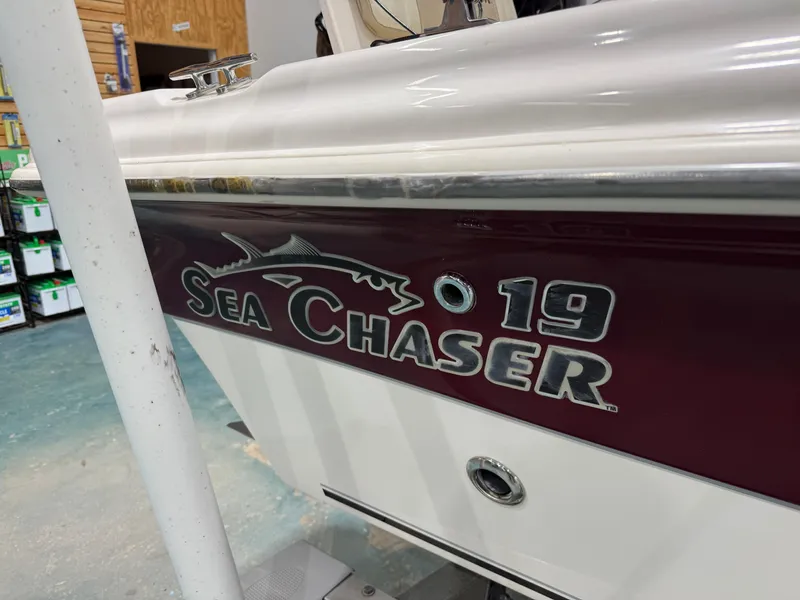 Slide: The Image of 2019 Carolina Skiff 19 Sea Chaser boat side view in showroom. - 10
