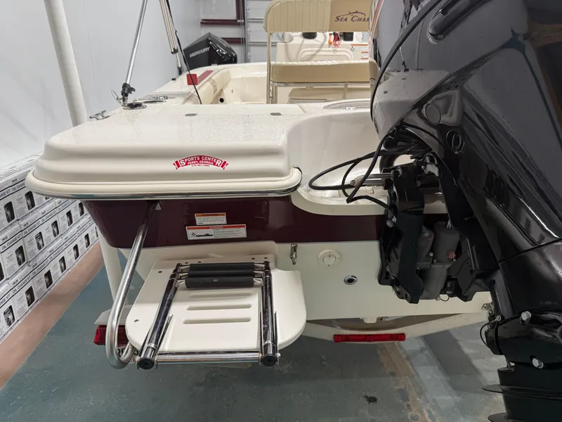 Slide: The Image of 2019 Carolina Skiff 19 Sea Chaser boat with outboard motor and swim ladder. - 11