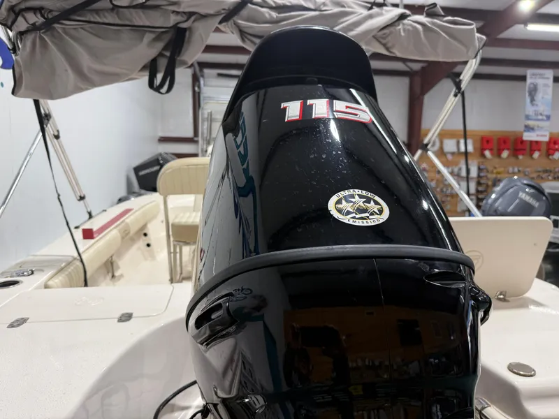 Slide: The Image of 2019 Carolina Skiff 19 Sea Chaser with 115 HP outboard motor in showroom. - 13