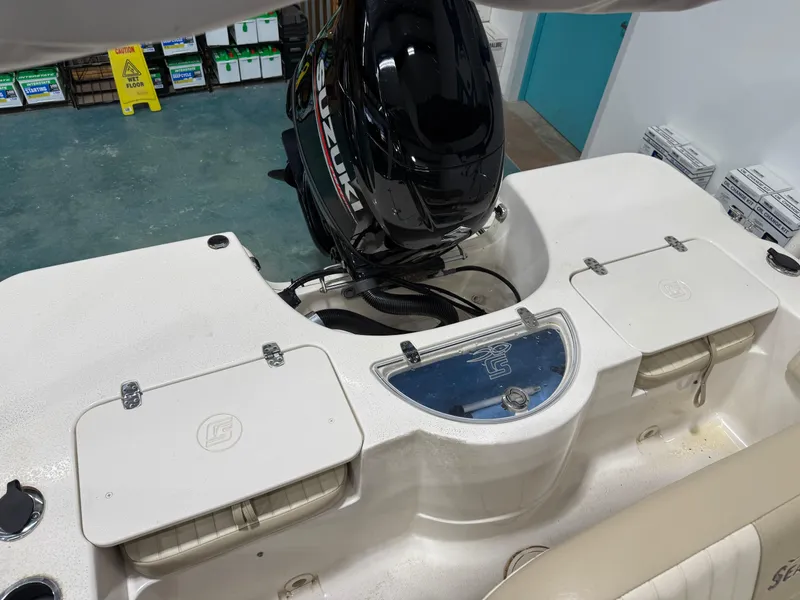 Slide: The Image of 2019 Carolina Skiff 19 Sea Chaser boat interior with Suzuki outboard motor. - 14