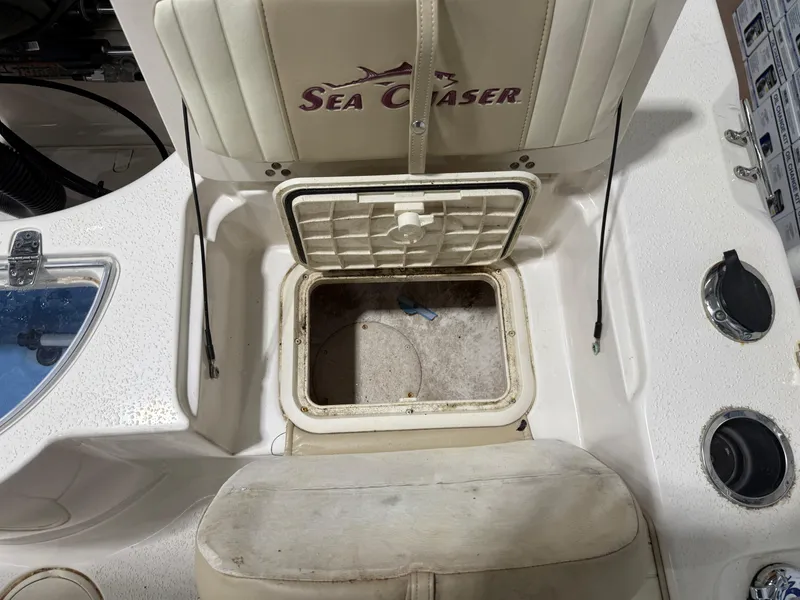 Slide: The Image of 2019 Carolina Skiff 19 Sea Chaser boat interior with open storage compartment. - 17