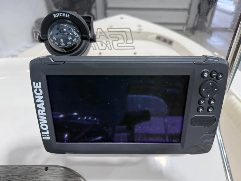 Slide: The Image of Lowrance GPS and Ritchie compass on 2019 Carolina Skiff 19 Sea Chaser boat. - 21