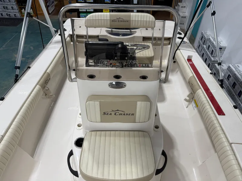 Slide: The Image of 2019 Carolina Skiff 19 Sea Chaser boat interior with seating and console. - 27