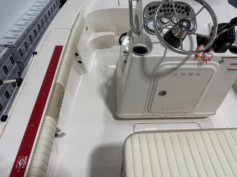 Slide: The Image of 2019 Carolina Skiff 19 Sea Chaser boat interior with steering console and seating. - 29