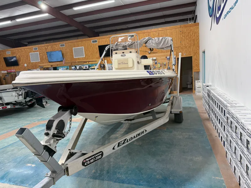 Slide: The Image of 2019 Carolina Skiff 19 Sea Chaser boat on trailer in showroom. - 7