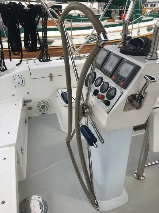 Slide: The Image of Cockpit of 2004 Catalina 42 MkII sailboat with steering wheel and navigation instruments. - 16
