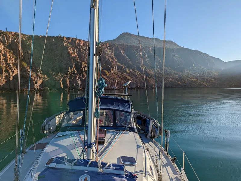 Slide: The Image of Sailing on a 2004 Catalina 42 MkII yacht in a serene mountain lake setting. - 21