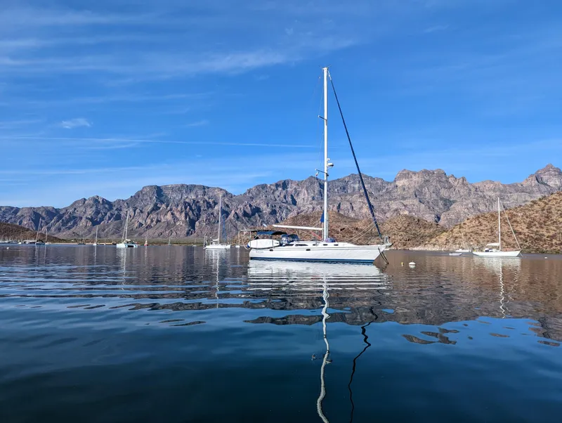 Slide: The Image of Catalina 42 MkII sailboat on calm water with mountainous backdrop, 2004 model. - 22