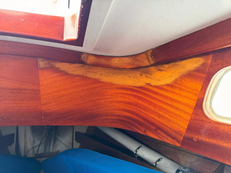 Slide: The Image of Wood interior of a 1969 Ohlson 38 boat showing water damage and discoloration. - 22