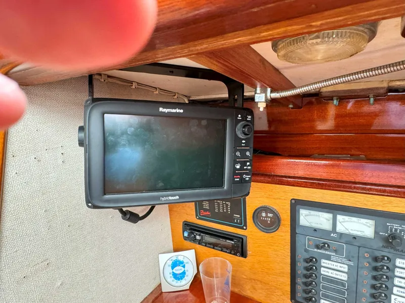 Slide: The Image of Raymarine navigation system inside a 1969 Ohlson 38 sailboat cabin. - 24
