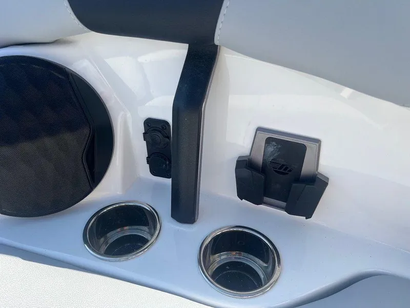 Slide: The Image of Interior of 2025 Malibu 23 LSV boat with cup holders and speaker. - 16