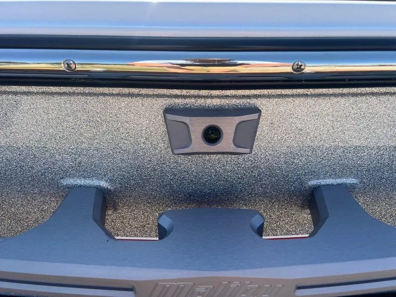 Slide: The Image of 2025 Malibu 23 LSV boat detail with camera and textured surface. - 20