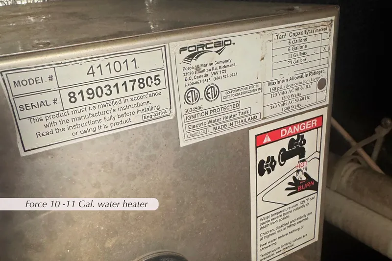 Slide: The Image of Force 10-11 gallon water heater with safety warnings and specifications label. - 24