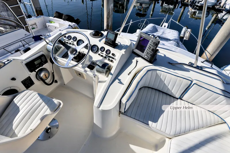 Slide: The Image of 1988 Mediterranean 38 Convertible boat's upper helm with modern navigation equipment. - 4