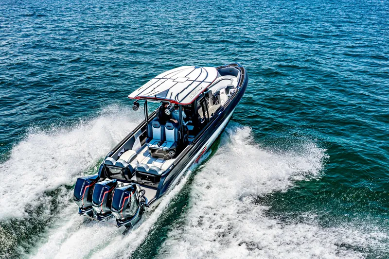 Slide: The Image of 2025 Glasstream GSX boat cruising on open water, showcasing powerful engines and sleek design. - 0