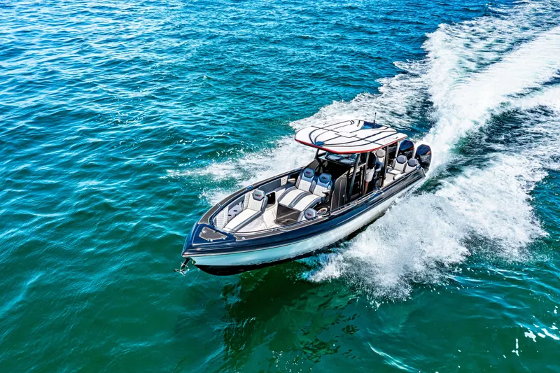 Slide: The Image of 2025 Glasstream GSX boat cruising on clear blue water. - 10
