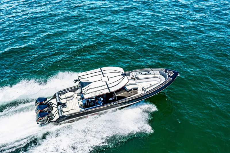 Slide: The Image of 2025 Glasstream GSX boat cruising on open water, aerial view. - 12