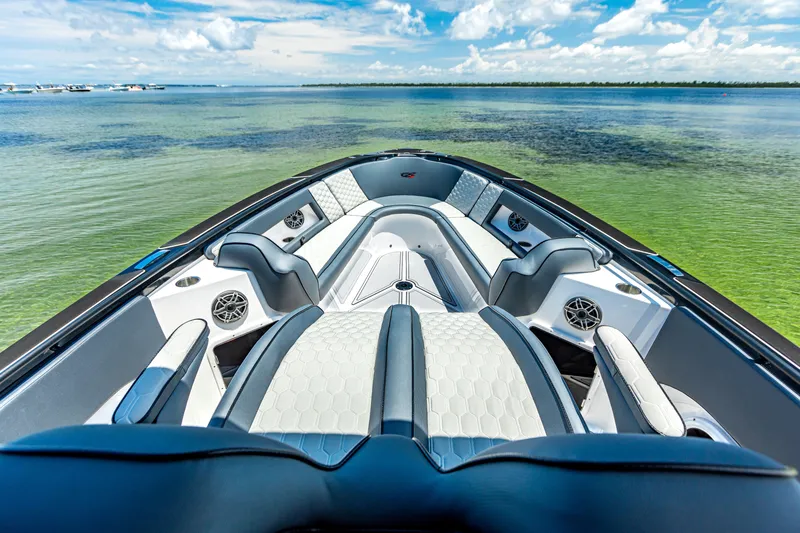 Slide: The Image of 2025 Glasstream GSX boat interior with luxurious seating on calm water. - 20