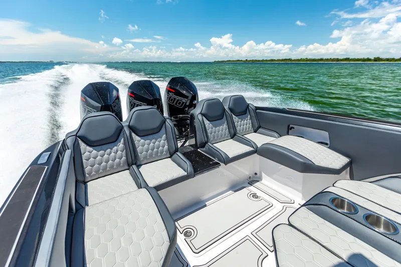 Slide: The Image of 2025 Glasstream GSX boat interior with sleek seating, powerful engines, cruising on open water. - 23