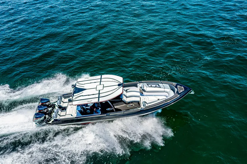 Slide: The Image of 2025 Glasstream GSX speedboat cruising on open water, aerial view. - 25