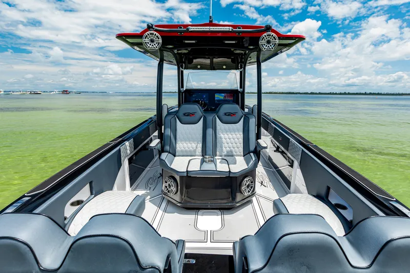 Slide: The Image of 2025 Glasstream GSX boat interior with modern seating on a sunny day. - 4