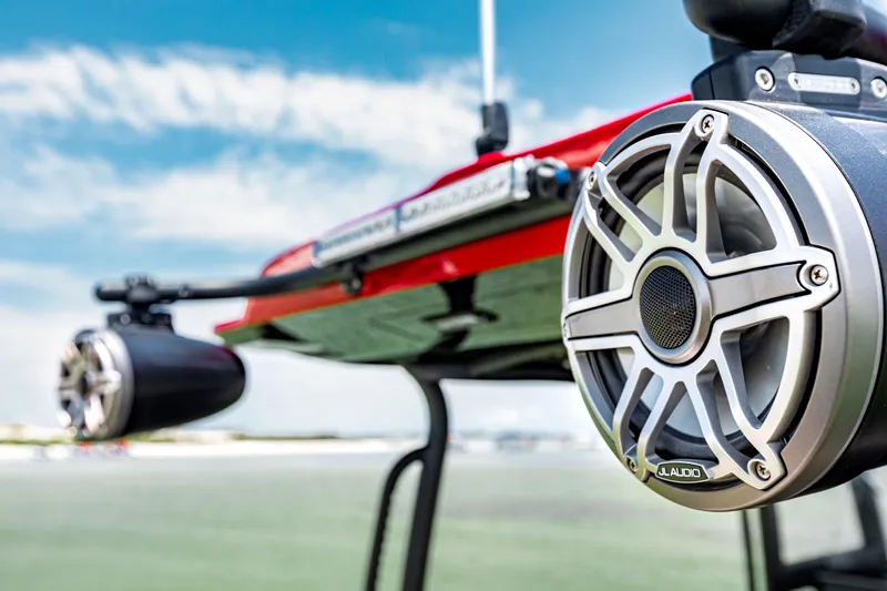 Slide: The Image of 2025 Glasstream GSX boat with premium audio speakers, set against a clear blue sky. - 6