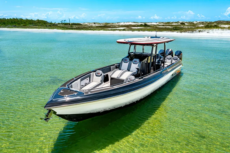 Slide: The Image of 2025 Glasstream GSX boat in clear turquoise water, showcasing sleek design and modern features. - 8