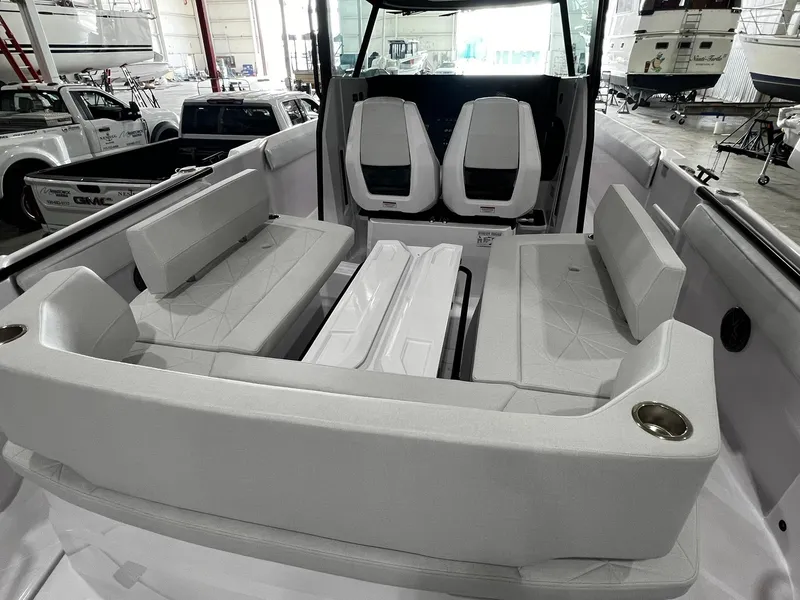 Slide: The Image of 2025 Axopar 29 CCX boat interior with modern seating and sleek dashboard design. - 11