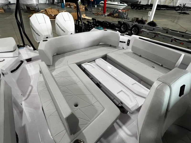 Slide: The Image of Interior view of 2025 Axopar 29 CCX boat, featuring control panel and sleek design elements. - 13