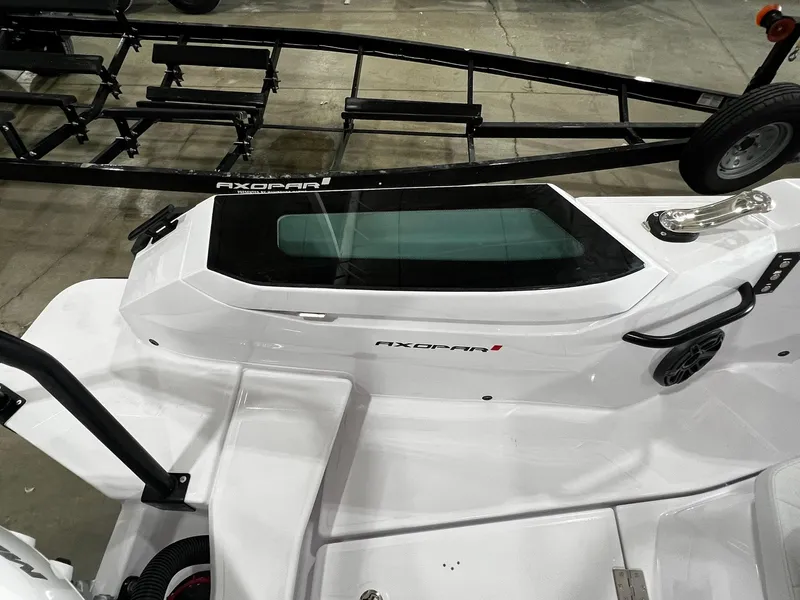 Slide: The Image of 2025 Axopar 29 CCX boat dashboard with Simrad electronics and communication devices. - 15