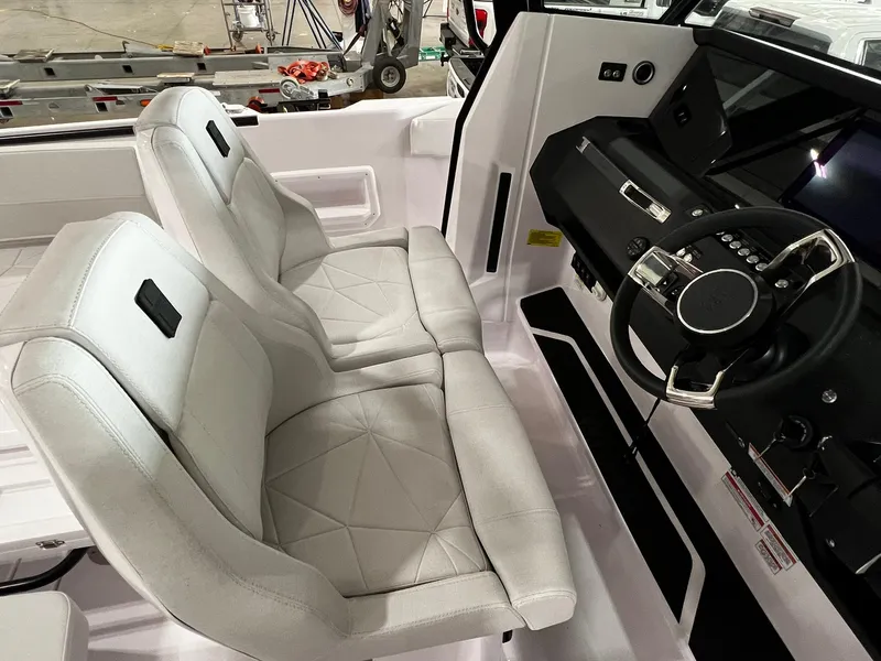 Slide: The Image of 2025 Axopar 29 CCX boat interior with seating and storage compartments. - 17