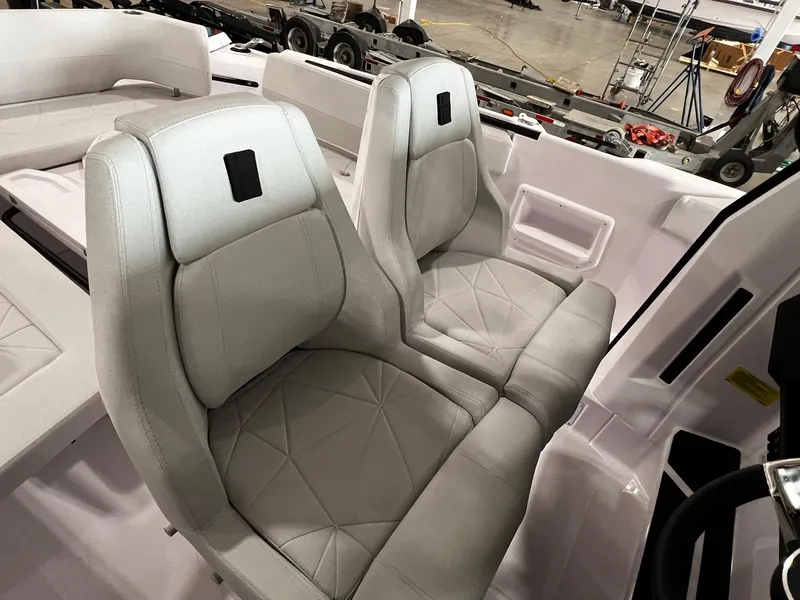 Slide: The Image of 2025 Axopar 29 CCX boat interior with sleek seating and modern design. - 18