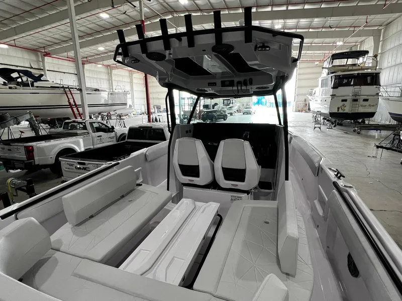 Slide: The Image of 2025 Axopar 29 CCX cabin interior with toilet and seating area. - 30