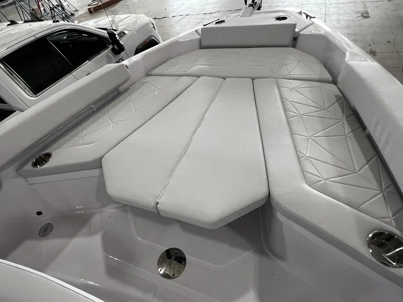 Slide: The Image of 2025 Axopar 29 CCX cabin interior with toilet, gray cushions, and modern design. - 31